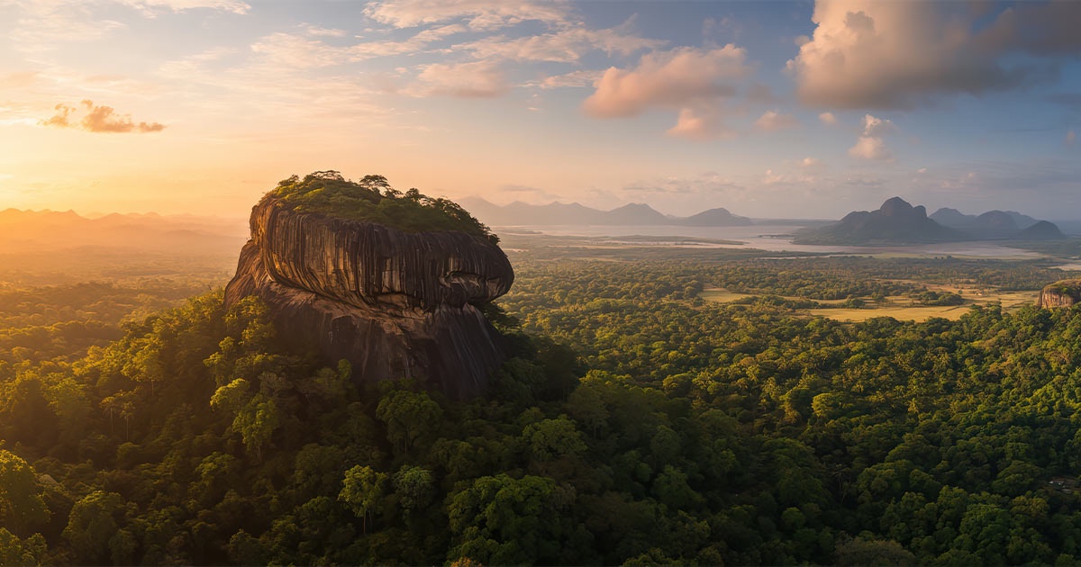 A traveler approaching Sigiriya through its ancient water gardens